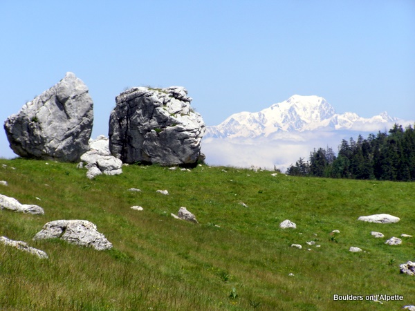 Photograph of twin giant boulders with Mont Blanc on l'Alpette